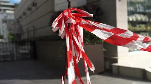 Close-up construction red and white ribbon swings in the wind of the vegetable Stock Footage 197467860
