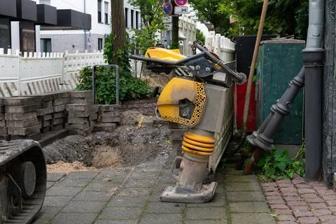 A close-up of a construction site with vibratory rammer. Stock Photos