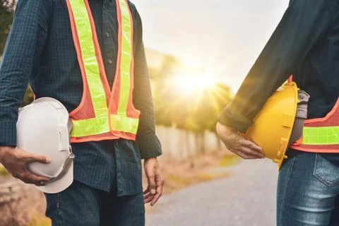 Close up Construction Supervisor Foreman holding helmet hard hat Stock Photos