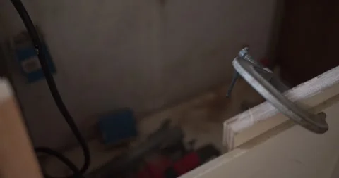Close-up of a construction tool and unfinished cabinetry inside a Louisiana Stock Footage 343843796