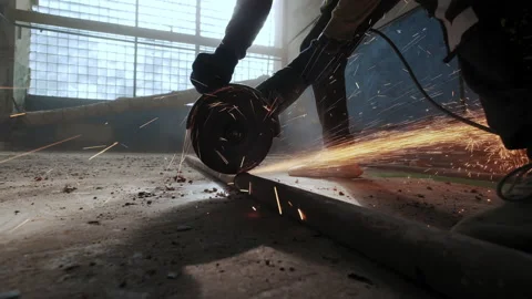 Close up. Construction worker cuts steel with a circular saw, construction Stock Footage 164181163