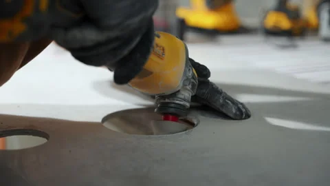 Close-up of a construction worker grinding a tile surface using a powe Stock Footage 327250573