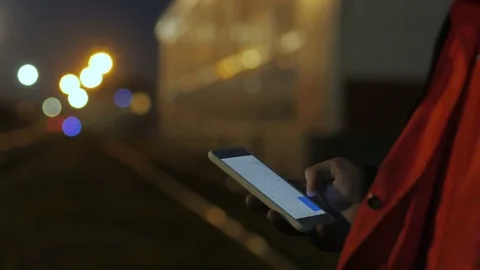 Close up of construction worker hands using phone in the twilight. 4k Video stock 83760822
