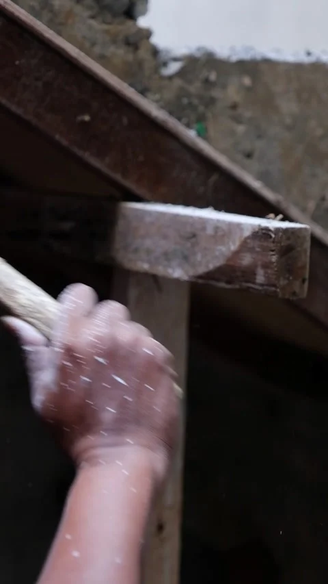 Close-Up of Construction Worker Hitting Wooden Frame with Hammer Stock-Footage 342883020