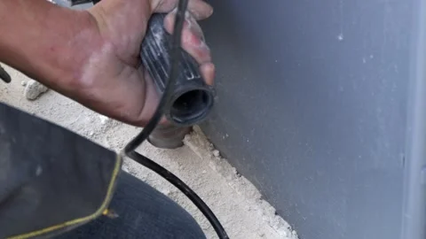 Close-up of construction worker using power tools safety in an industrial Stock Footage 302915912