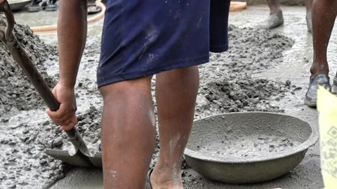 Close Up of Construction Workers Preparing Cement Mortar for Building Foundation Stock Footage 337850289
