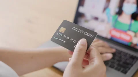 Close up consumer woman's hand holding credit card making online payment 스톡 동영상 140273398