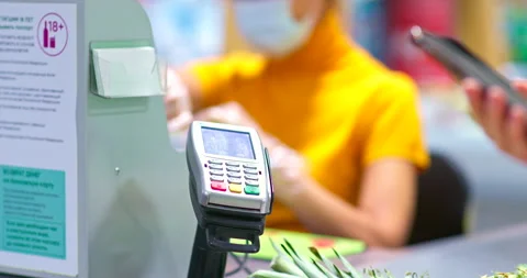 Close-up, contactless payment for purchases using a phone, nfc. Buyer brings the Stock-Footage 139845081