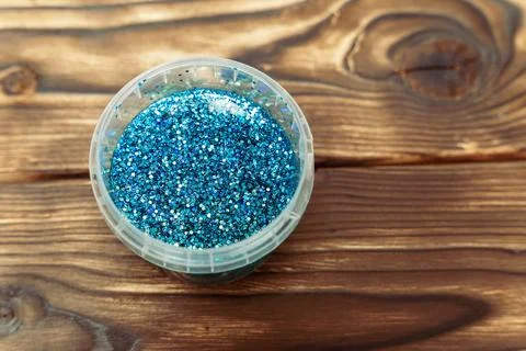 A close-up of a container filled with blue glitter Foto stock