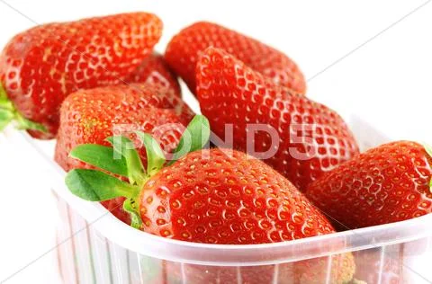 Close up of a container full of fresh strawberry Stock Photos