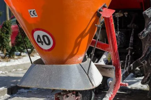 Close-up of container  for spilling salt.  Standing  snow cleaning machine  c Stock Photos