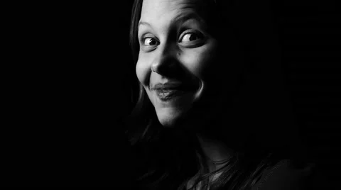 Close up contrasty black and white portrait of a young teen girl smiling at the Stock Footage 62895232