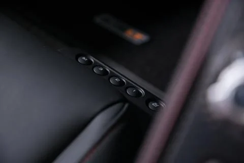 Close up of control panel with buttons on memory leather car seat Stock Photos