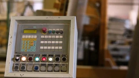 Close up of control panel of heavy machinery inside a stone tile plant Stock Footage 117470541