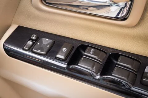 Close Up of controls button switch on the door. Interior detail Foto stock