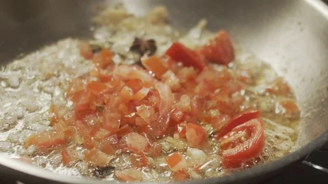 Close-up cook adds greens in pan with vegetables. Slow motion video Stock Footage 124687040