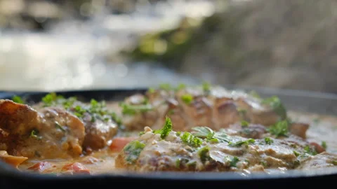 Close up of cook baked chicken with sun-dried tomatoes and cheese sauce in pan Stock Footage 303958534