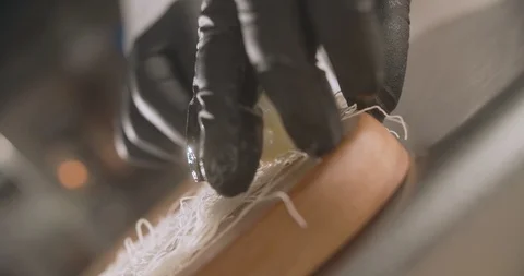 Close-up of cook in gloves talking tiger shrimp into kataifi dough Stock Footage 115497137