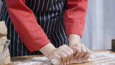 Close up of cook hand Or chef kneading the dough in kitchen To make food Stock Footage 139573317