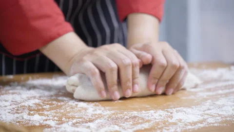 Close up of cook hand Or chef kneading the dough in kitchen To make food Stock Footage 139573793