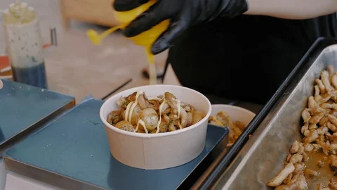 Close-up, Cook Hands Add to Dish with Potatoes and Meat Grated Cheese and Stock Footage 112677920