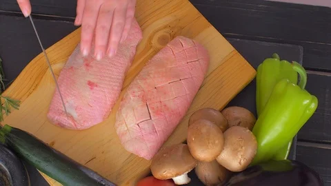 Close up of cook hands with a knife slicing duck breast meat. Stock Footage 110043798