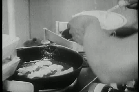 Close-up of cook preparing bacon and eggs on stove Video stock 11356247