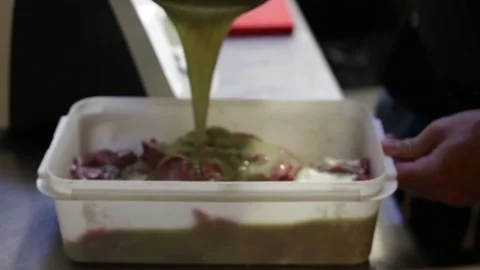Close up of a cook preparing a meat marinade Stock Footage 137945731