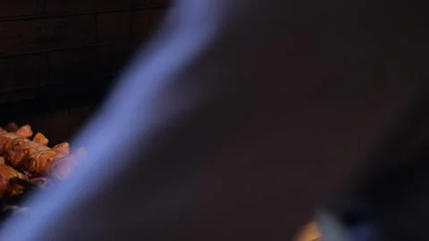 Close-up of the cook roasting meat on the grill. Stock Footage 320878038