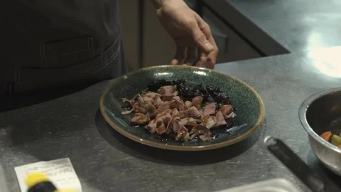 Close-up cook serving meat salad Video stock 247030483