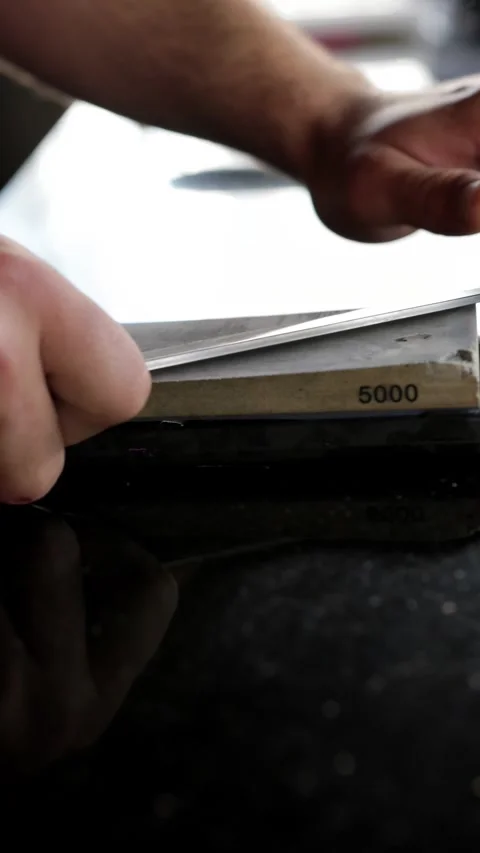 Close-Up of Cook Sharpening Knife Stock Footage 288577233