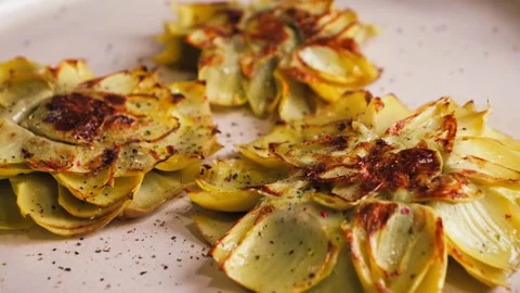 Close-up of cooked and fried artichoke flowers, traditional Spanish dish flores 스톡 동영상 335712767