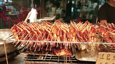 Close up of cooked BBQ chicken wings Skewers on Display Rack at Chinese Night 動画素材 341780208