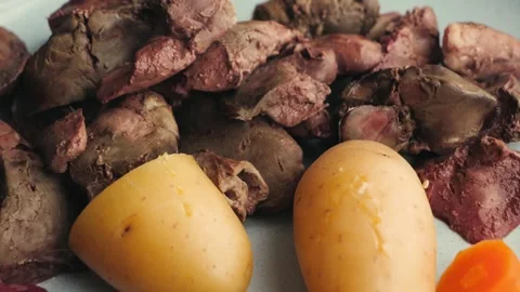 Close up of cooked chicken liver with potatoes and vegetables, homemade meal and Stock Footage 333232666