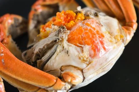 Close-up of cooked crab with orange roe Stock Photos