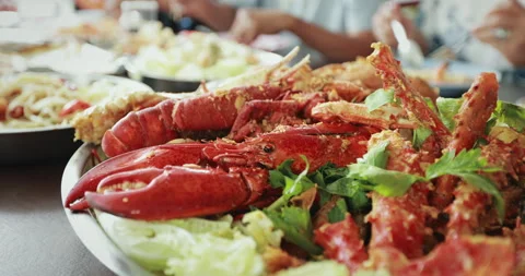 Close up on cooked lobster shrimp in the large plate Stock Footage 287546594