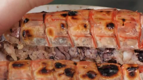 Close-up of Cooked Mantis Shrimp Being Peeled to Reveal Meat Stock Footage 344222504