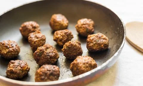 Close up of cooked meatballs on a baking sheet Stock Photos