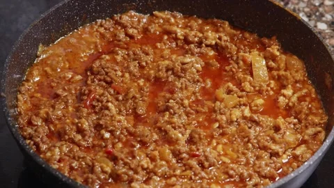 Close up of cooked minced meat sauce in pan Stock Footage 325261853