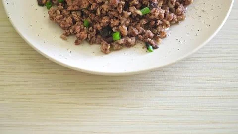 Close-up of cooked quinoa with vegetables on a white plate Stock Photos