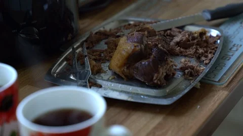 Close up of cooked sliced beef with steaming mug of tea, 4k Video stock 86981005
