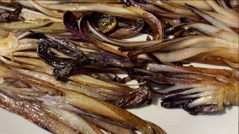Close-up of cooked Treviso red radicchio, Italy Stock Footage 229619498