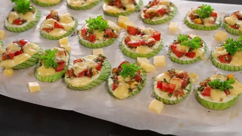 Close-up of cooked zucchini stuffed with tomatoes, herbs and cheese Stock Footage 270145769