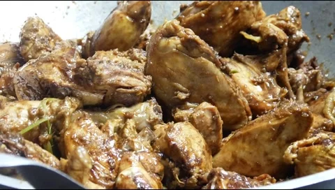 Close up of cooking chicken with sweet soy sauce seasoning Stock Footage 306758565