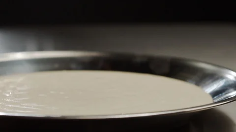 Close-up of cooking corn dog, sausage is dipped in long dough. Slow Motion Video Stock Footage 117471289