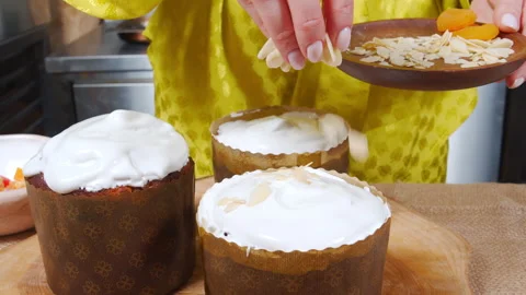 Close-up of cooking Easter cake. Female hands decorating delicious Easter cakes Stock Footage 172149821