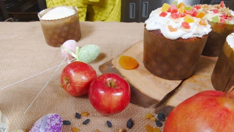 Close-up of cooking Easter cake. Female hands decorating delicious Easter cakes Stock Footage 182950782