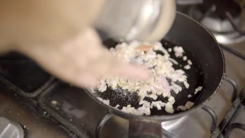 Close Up Cooking Ingredients in Frying Pan on Gas Stove with Hand Stirring Food Stock-Footage 346744851