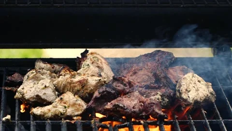 Close-up cooking meat on barbecue grilll, slow motion burning fire flame, smoke Stock Footage 190827494