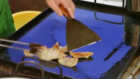 Close Up Cooking Pan Fried Dumplings at Streeet Vendor in China Stock Footage 120527774